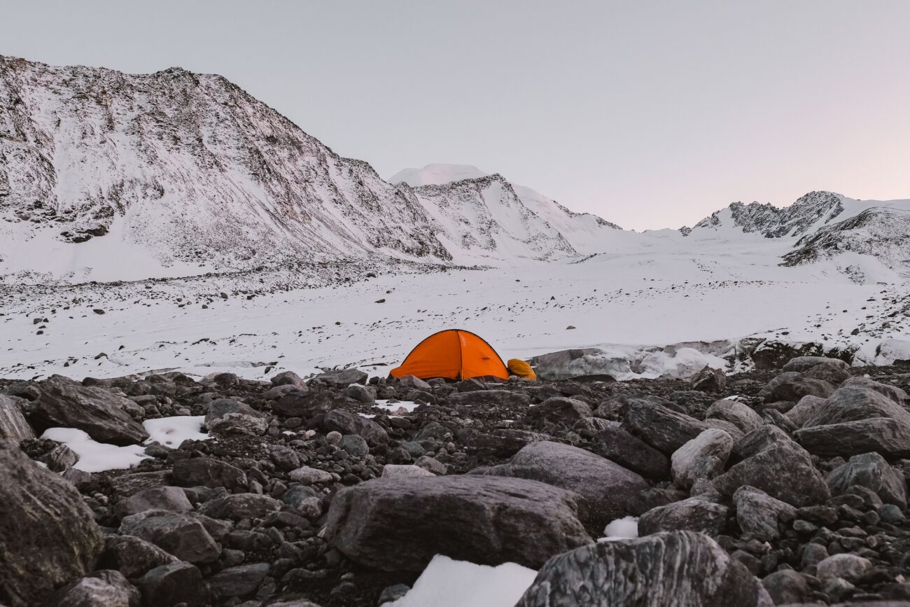 Ultralight trekking-pole tent similar to the Durston X-Mid pitched on rocky mountain terrain