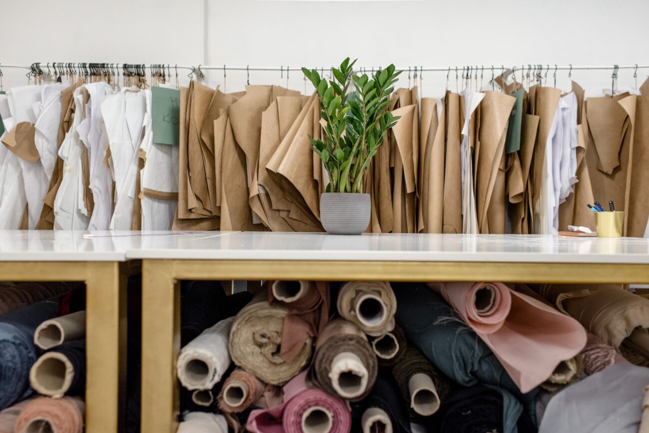Rolls of fabric on shelves, similar to how Dyneema composite fabric is sold by the yard