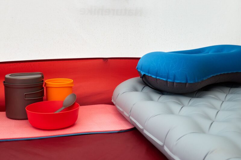 cozy camping tent setup with cookware